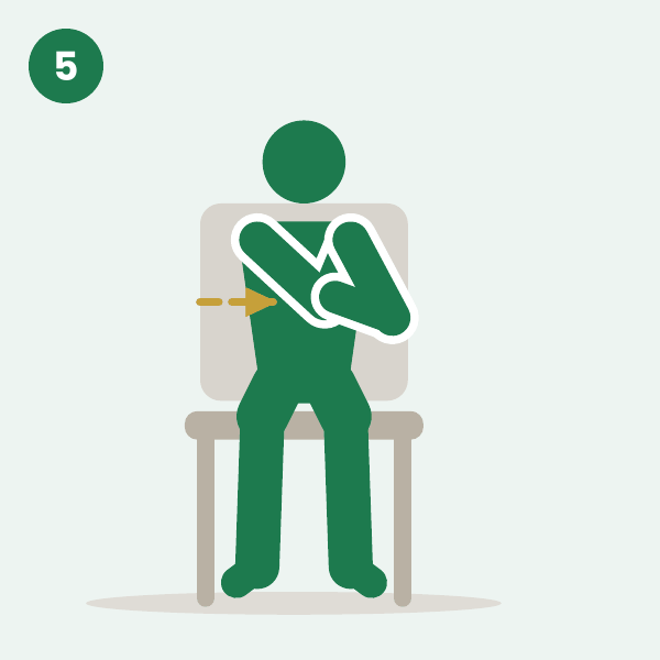 Shoulder stretch: a seated person pulls one elbow across the chest with the other hand